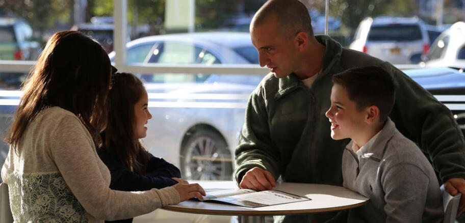 A miltary family deciding on a vehicle at Military Autosource