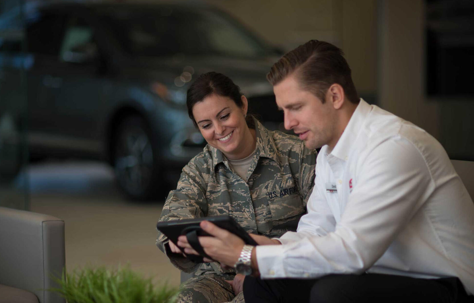 Military Autosource staff helping a customer